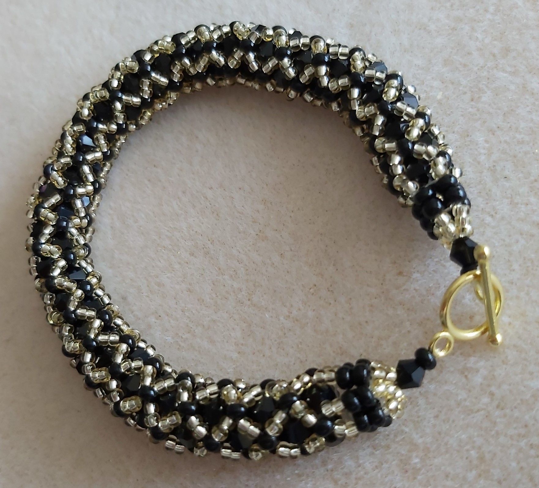 Black & Gold Tubular Netting Bracelet - 4mm Bicones and Miyuki seed beads 7.5"