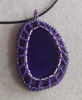 Purple Agate Gemstone slice with a surround made from  Miyuki Seed Beads Lined Violet & Miyuki 11/0 Silver Lined Smokey amethyst.
