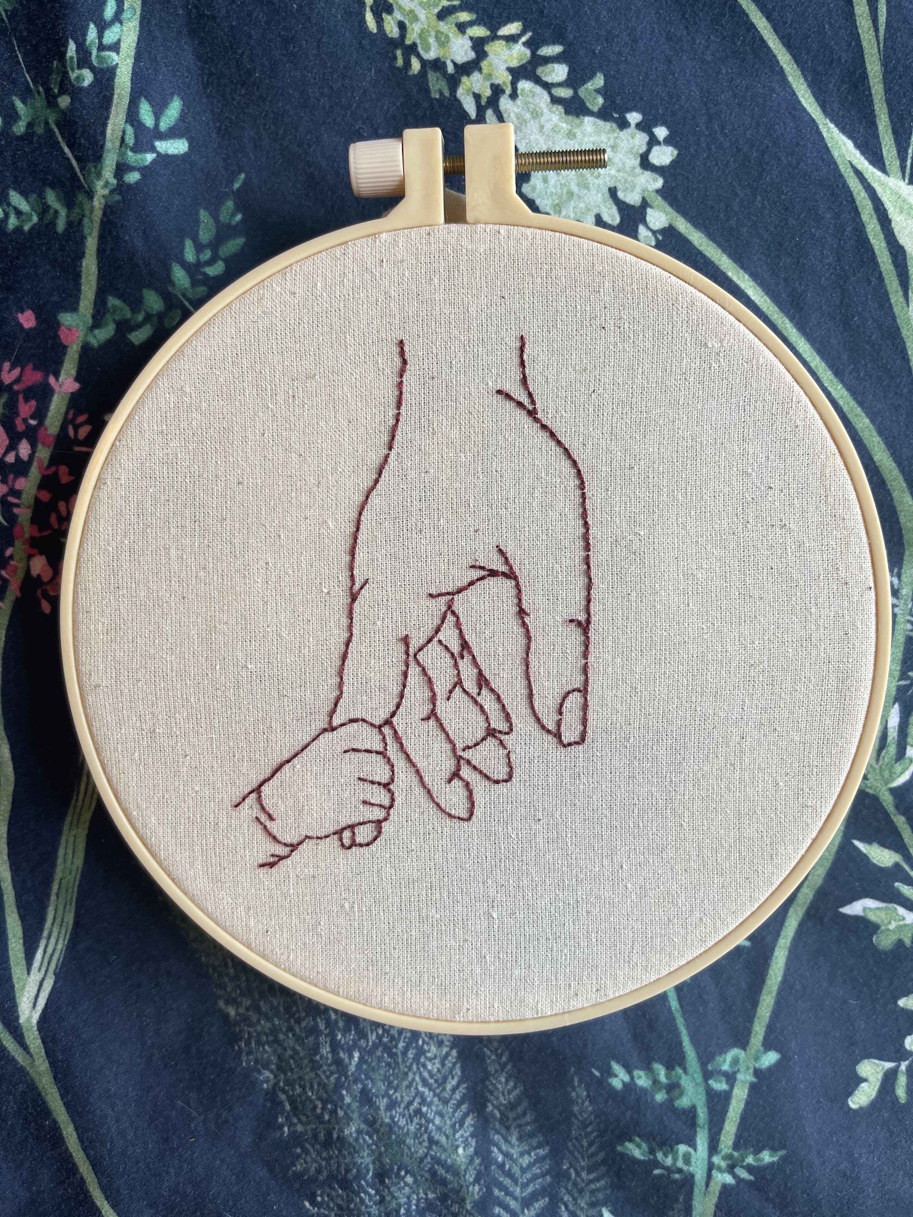 Hand-embroidered parent and child hoop