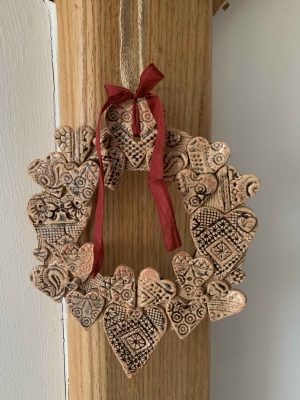 handmade-item handmade-gifts Deep Oxblood on Buff stoneware clay - Ceramic Heart wreath on jute ribbon with added silk bow.