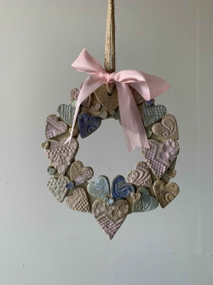 handmade-item handmade-gifts Sweet Pastel Ceramic Heart wreath on jute ribbon with added silk bow.