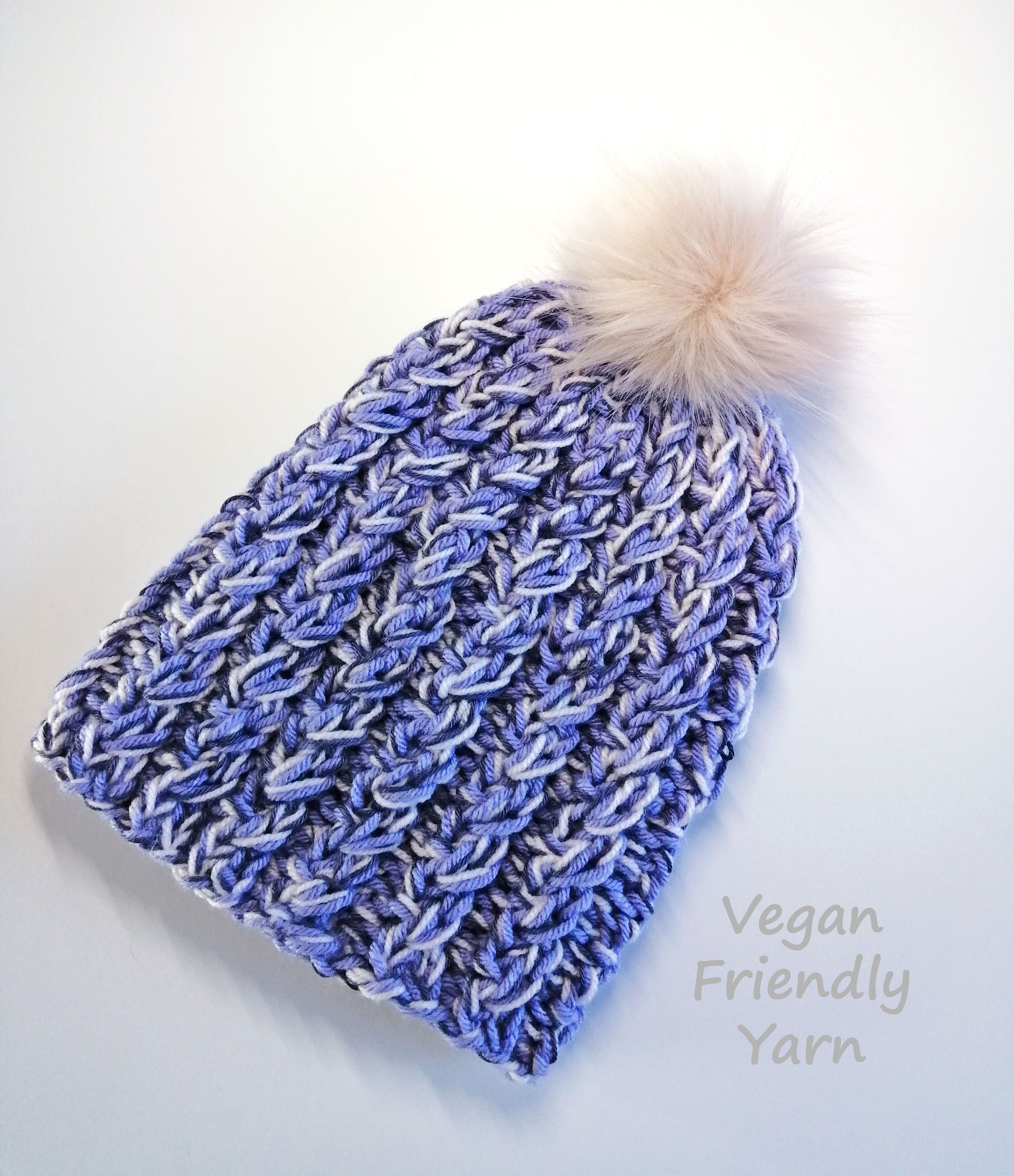 One-of-a-kind, Hand Knit Beanie / hat in Vegan Friendly acrylic and cotton yarns, with a faux fur pom. Lilac, lavender and pale pink.