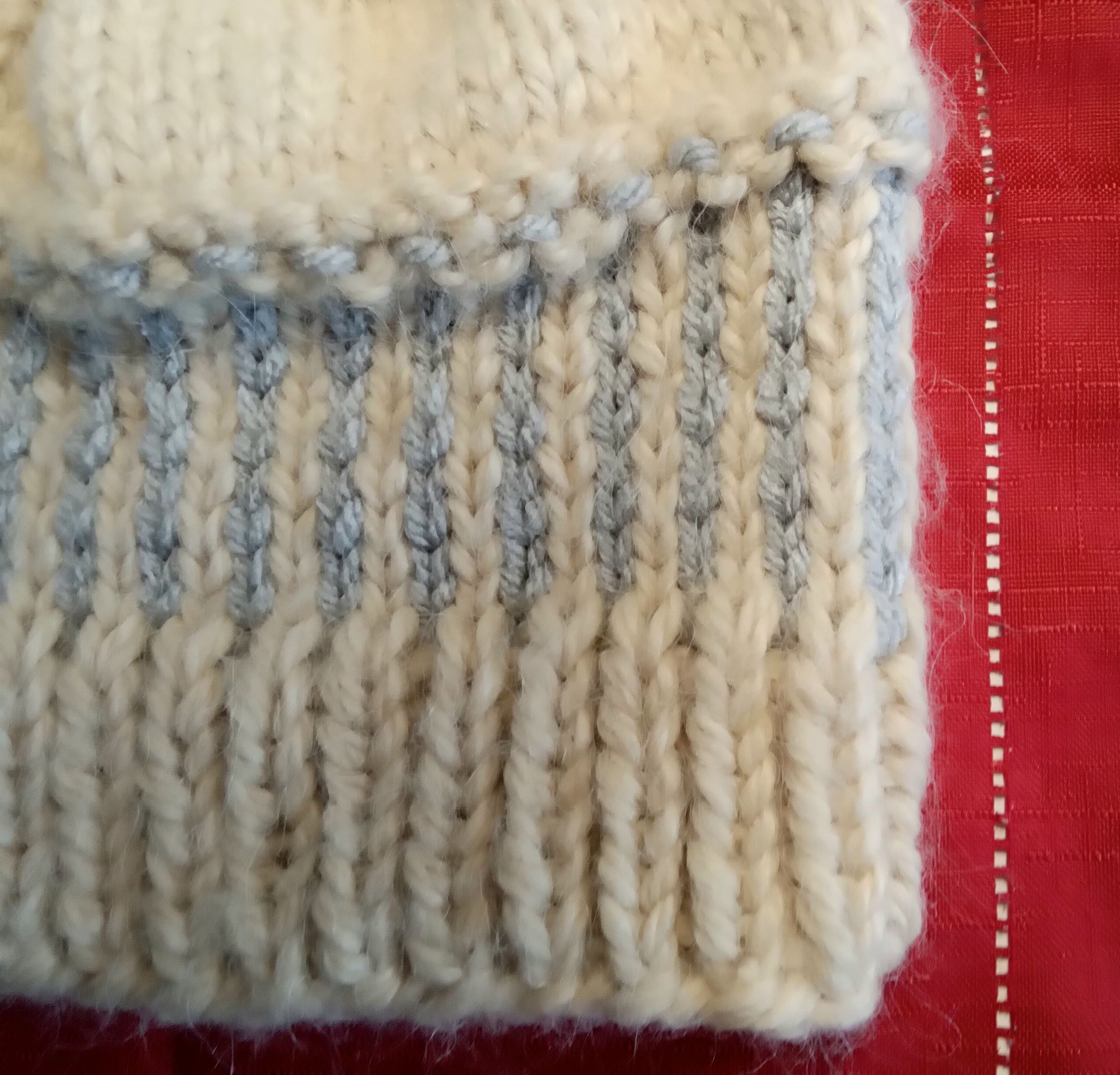 Hand knit beanie in premium chunky acrylic yarn, styled with a tassle 