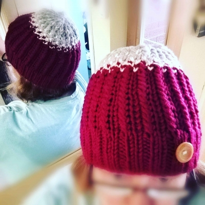 Hand knit beanie in premium chunky acrylic yarn, styled with wooden button