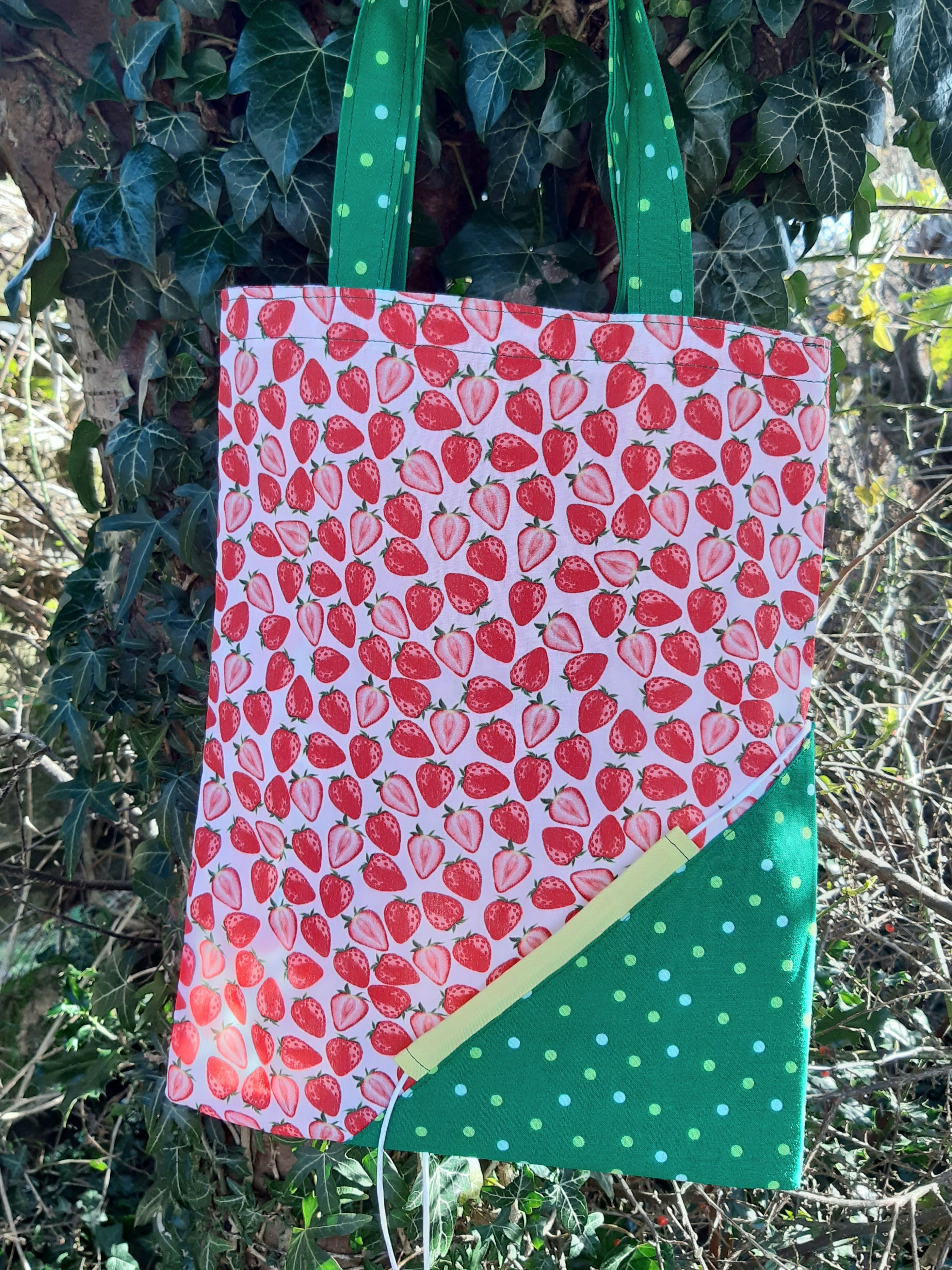 Foldable, reusable shopping bags in a strawberry shaped pouch