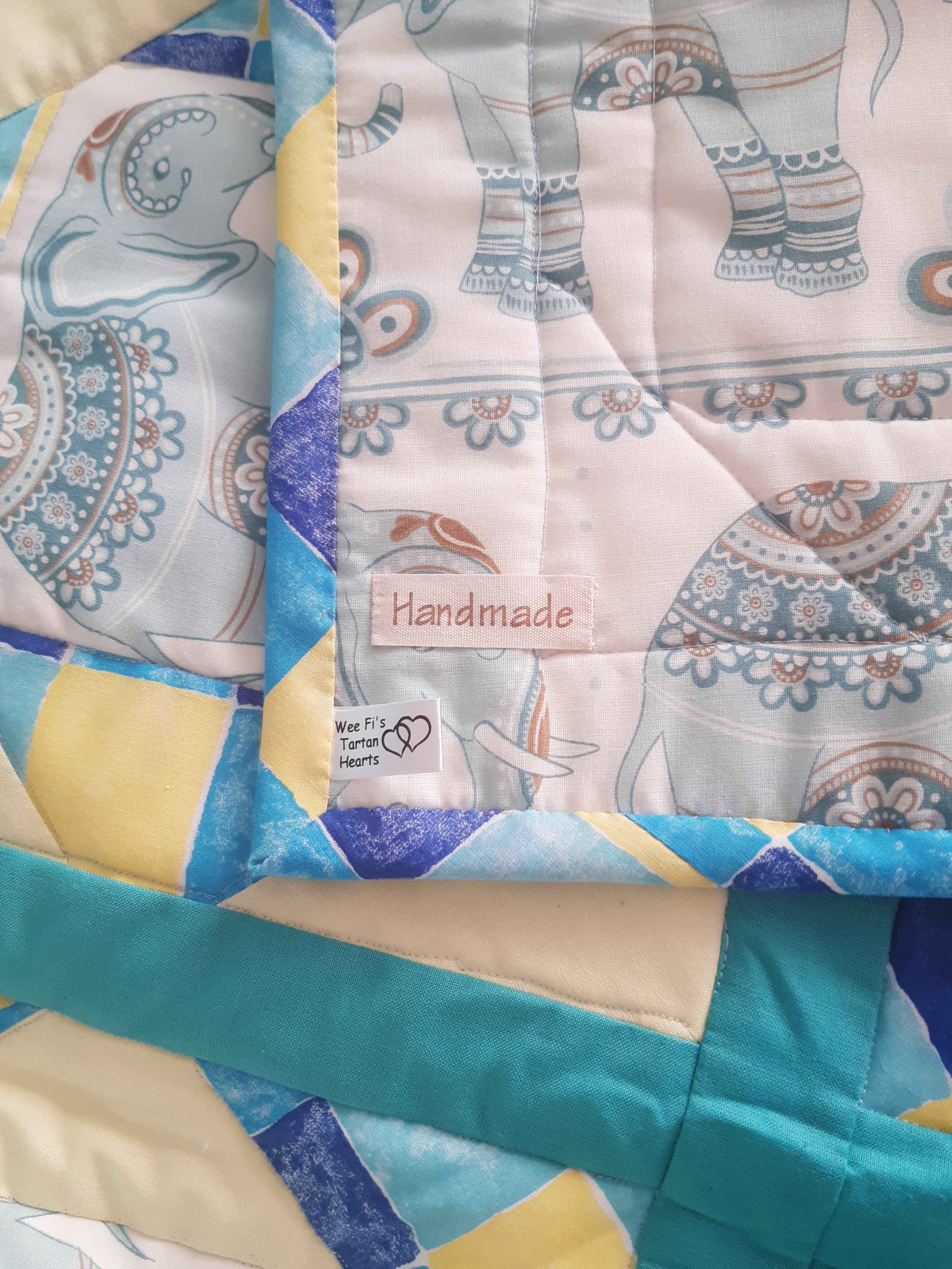 Turquoise and lemon patchwork lap quilt