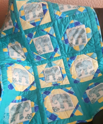 Turquoise and lemon patchwork lap quilt