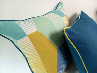 Sofa cushion set in teal, white, turquoise, mint green and yellow. Piped cushions, geometric design cushions.