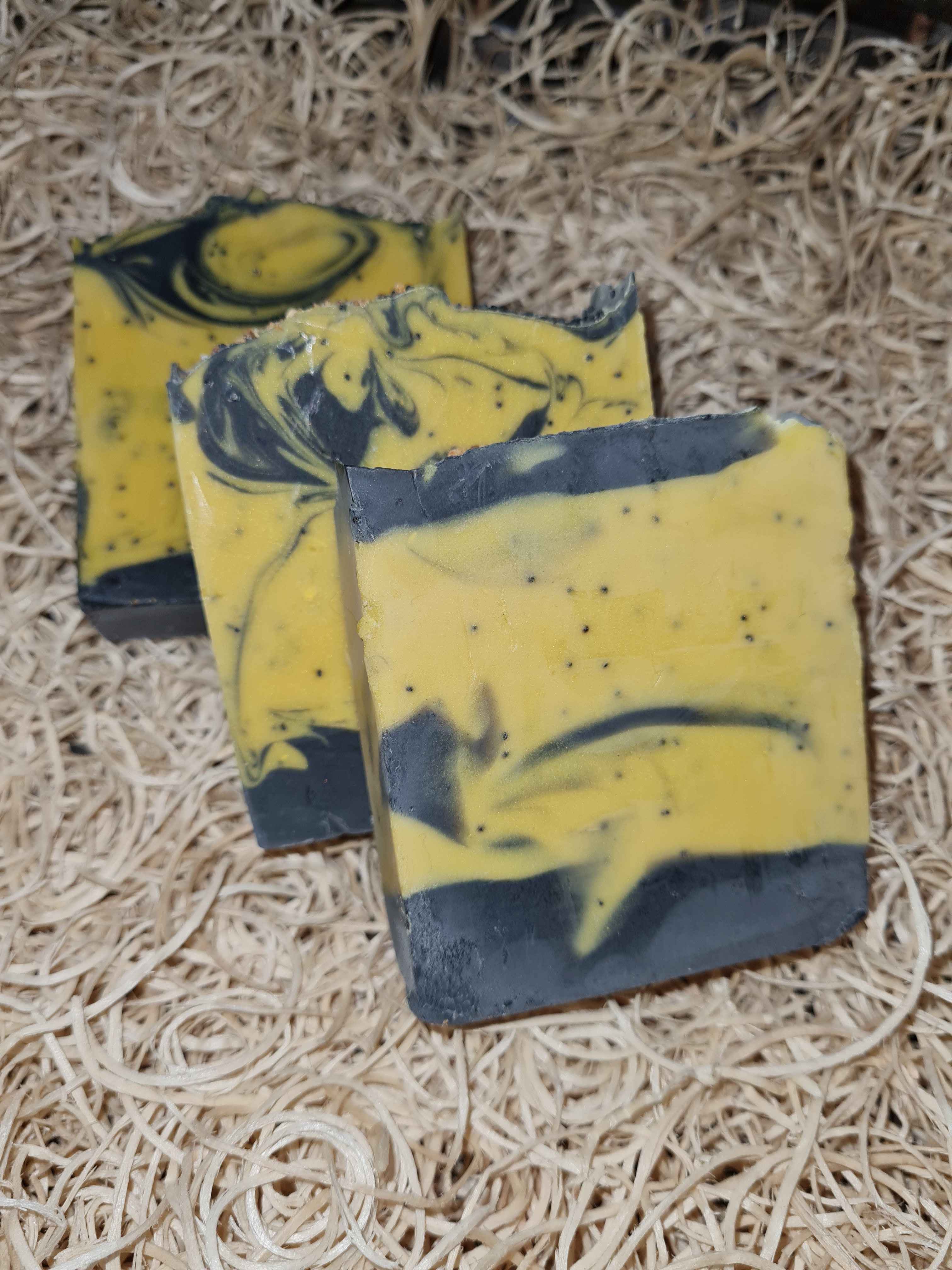 Goat's milk soap with Lemon essential oil, activated charcoal, Beeswax and poppy seeds 